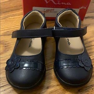 Navy blue patent toddler dress shoe. Size 5.